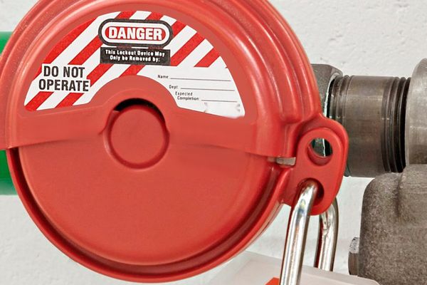 Valve lockout device secured with a padlock and danger tag